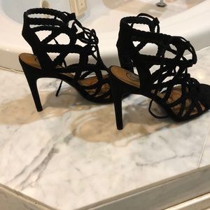 Net style, lace up heels in black. Never worn.